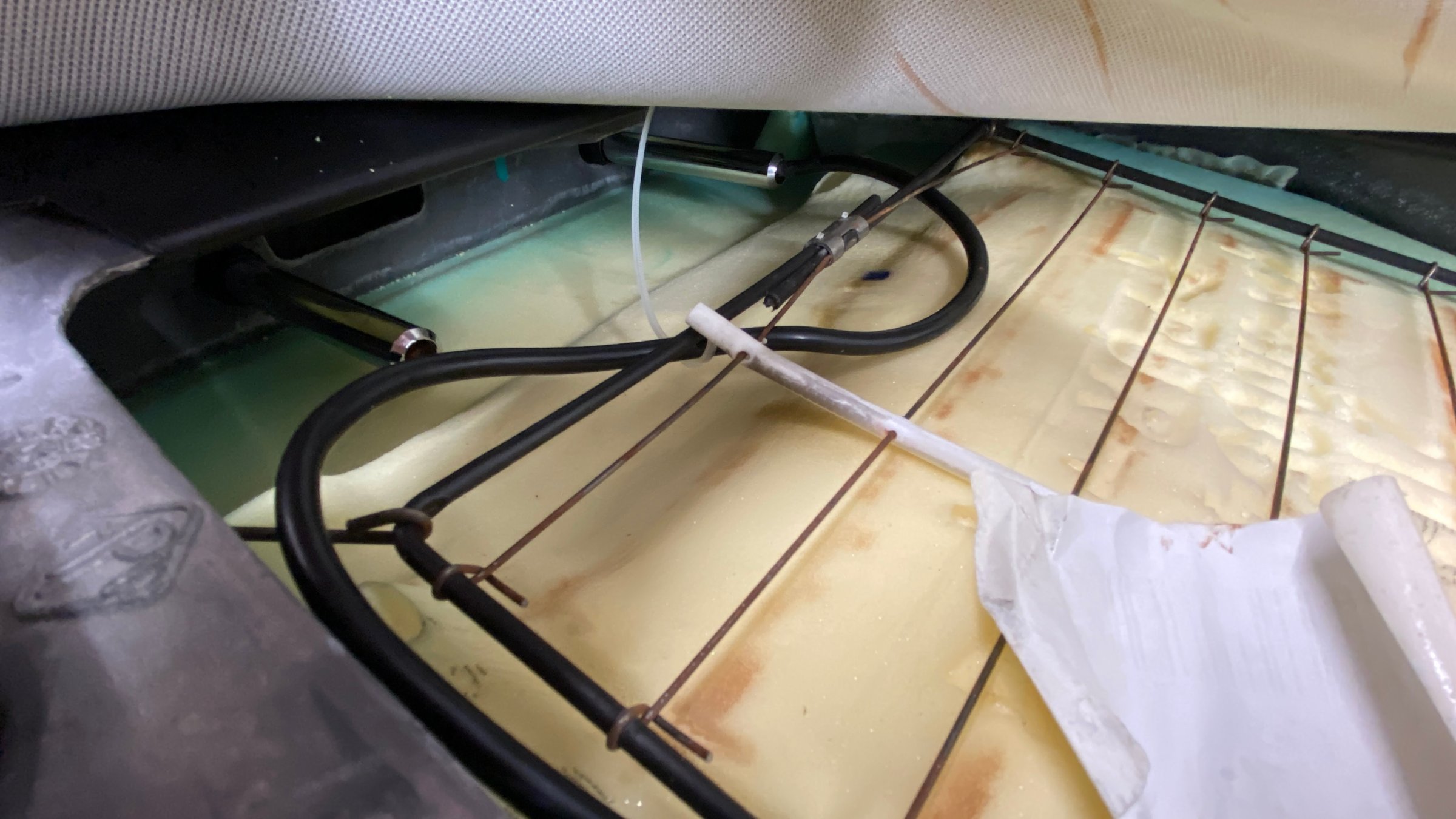 Seat backs opened up to route cable from headrests down to floor centre console