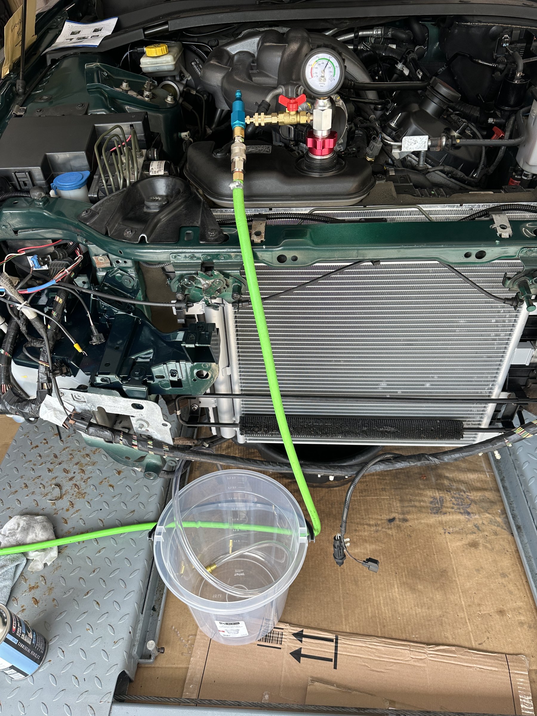 Creating vacuum in cooling system in readiness to add final fill of 50% coolant and 50% deionised water